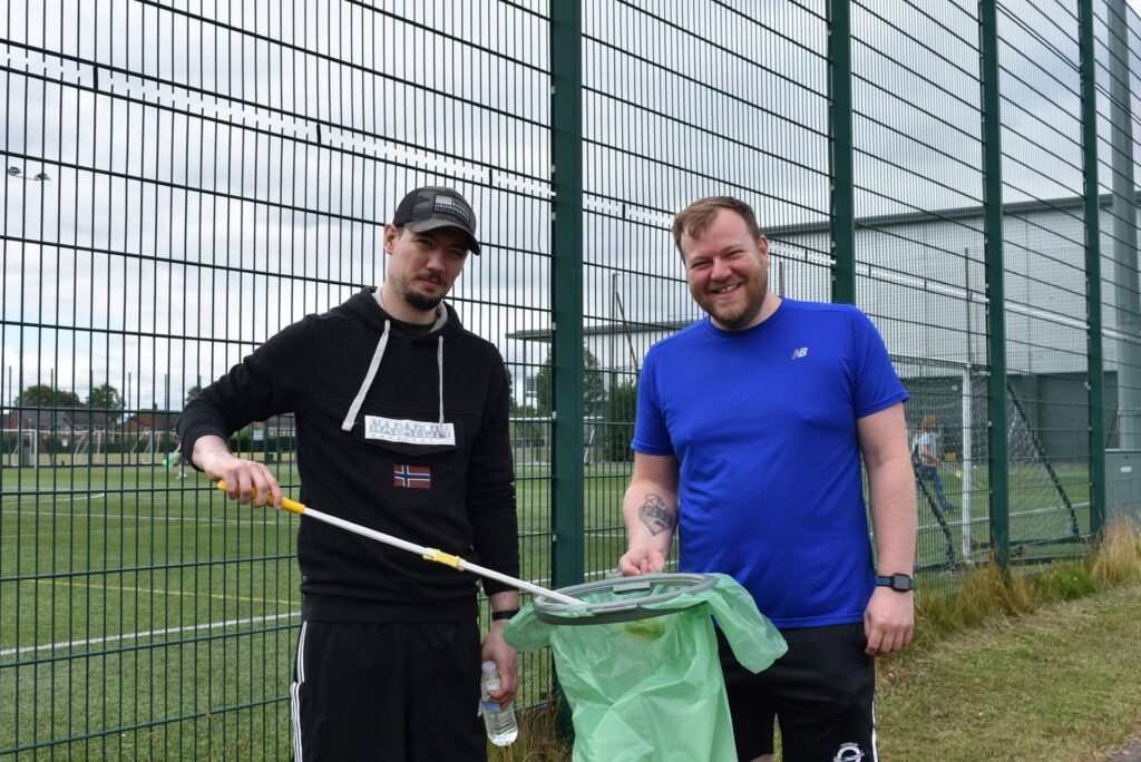 Two Etc. staff taking part in a litter pick in Billingham.