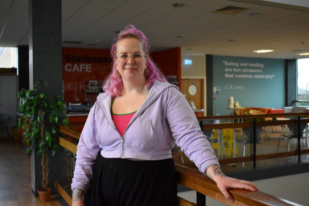 Artist standing in the library
