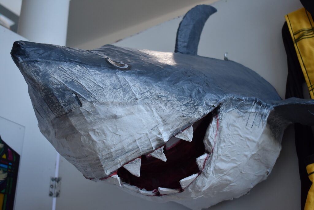 Sharks sculpture in college art exhibition