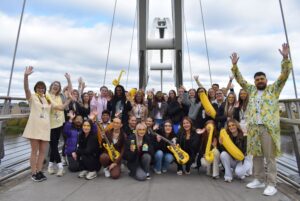 Health and Social Care students standing on Infinity Bridge.