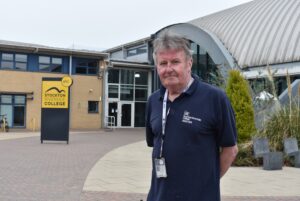 Stuey standing outside Stockton Riverside College