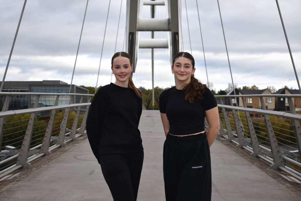 Two performing arts students standing on the Infinity Bridge