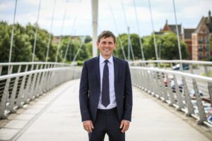 Etc. chief executive Grant Glendinning standing on the Infinity Bridge