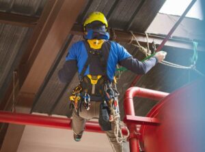 person climbing as part of rope access role