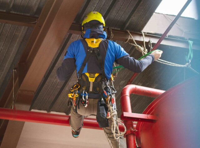 person climbing as part of rope access role