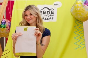 Sophie with her results at Bede