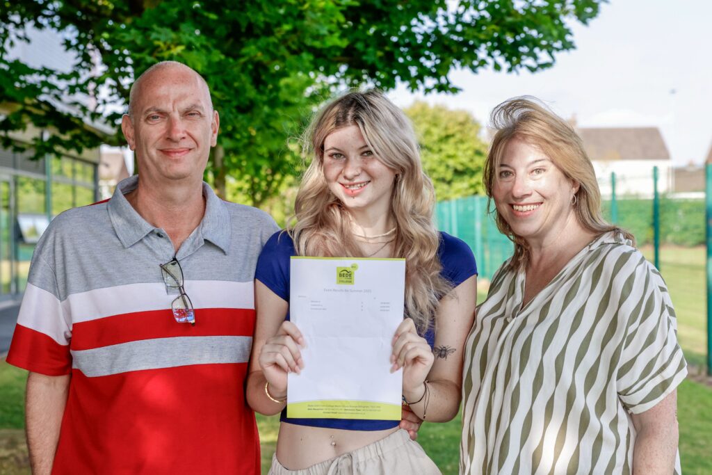 Sophie with her parents on results day at Bede