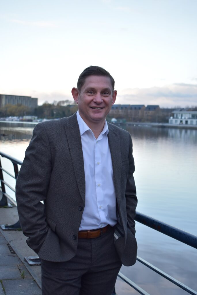 Jason Faulkner standing beside the River Tees