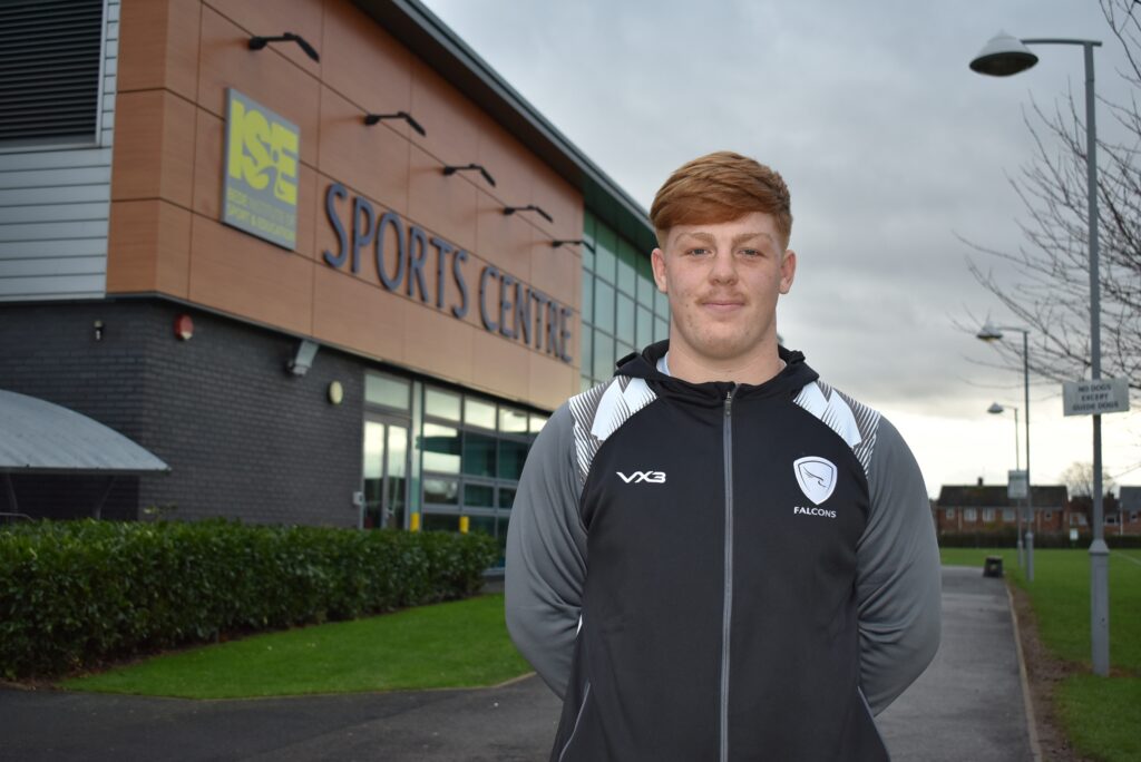Myles standing outside Bede Sports Centre