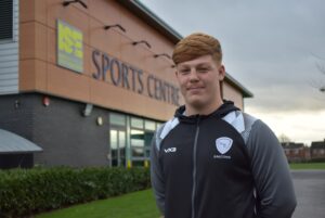 Myles standing outside Bede Sports Centre