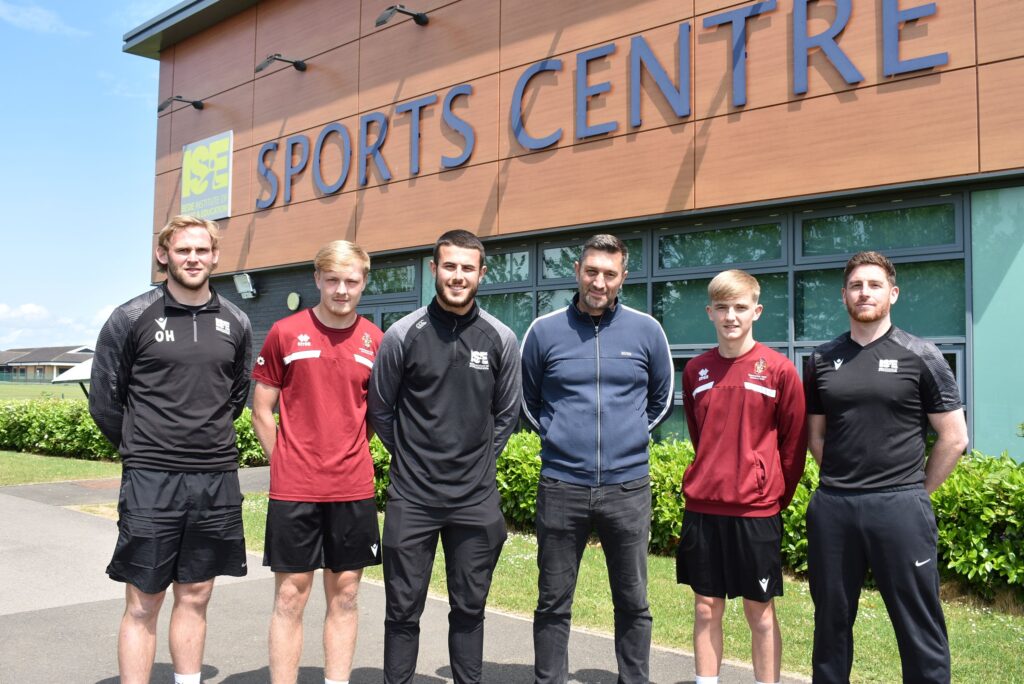 Staff from Bede, students and guests from Spennymoor Town FC at Bede Sports Centre
