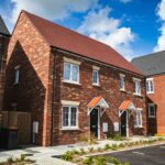 a new build house surrounded by other houses